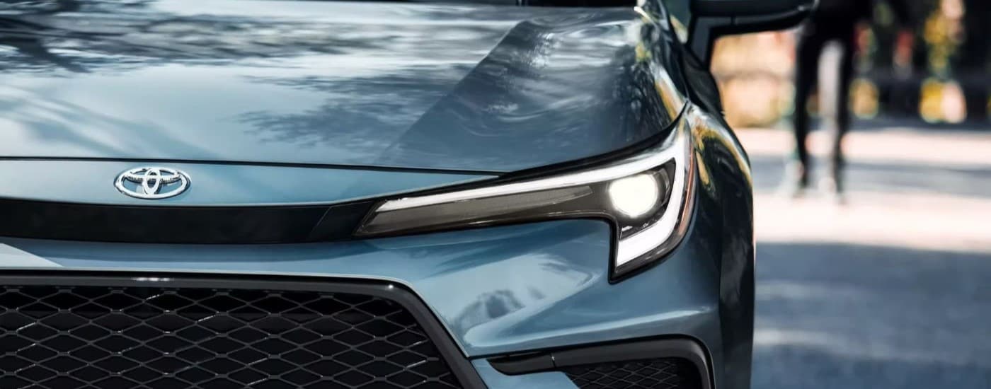 Headlight of a blue 2026 Toyota Corolla