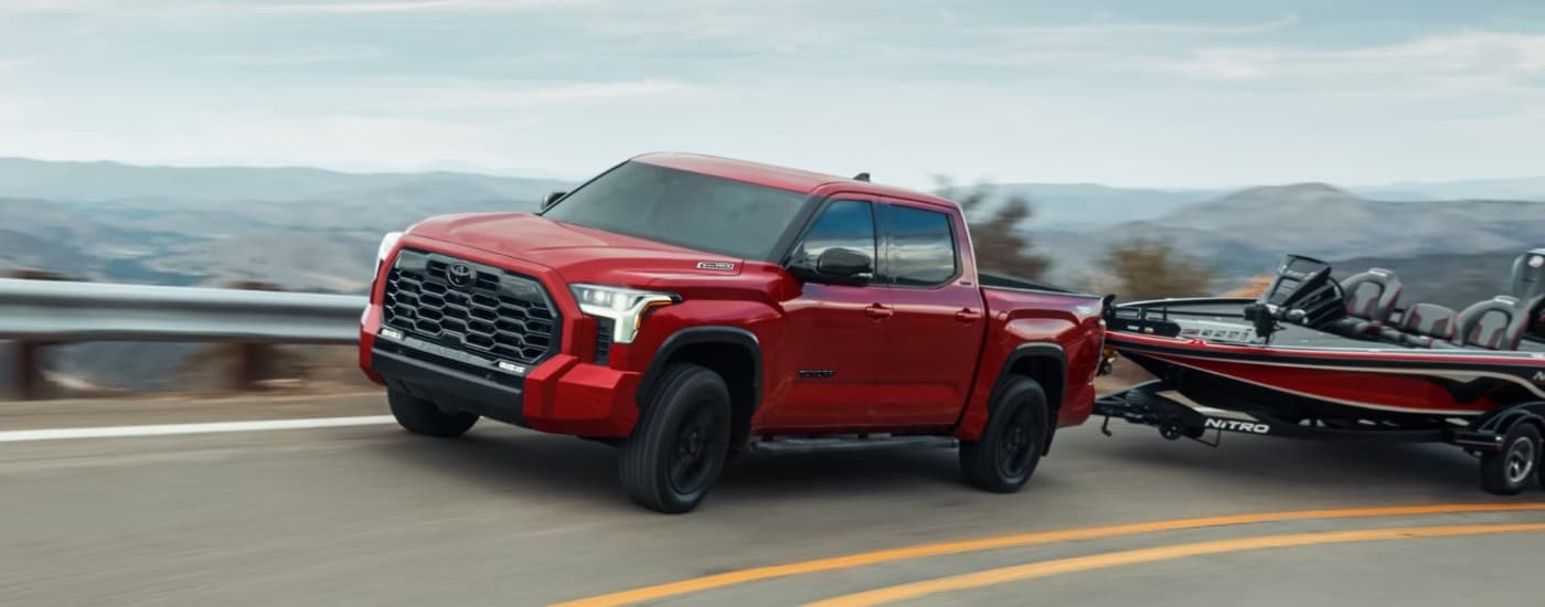 A red 2023 Toyota Tundra from the front at an angle.
