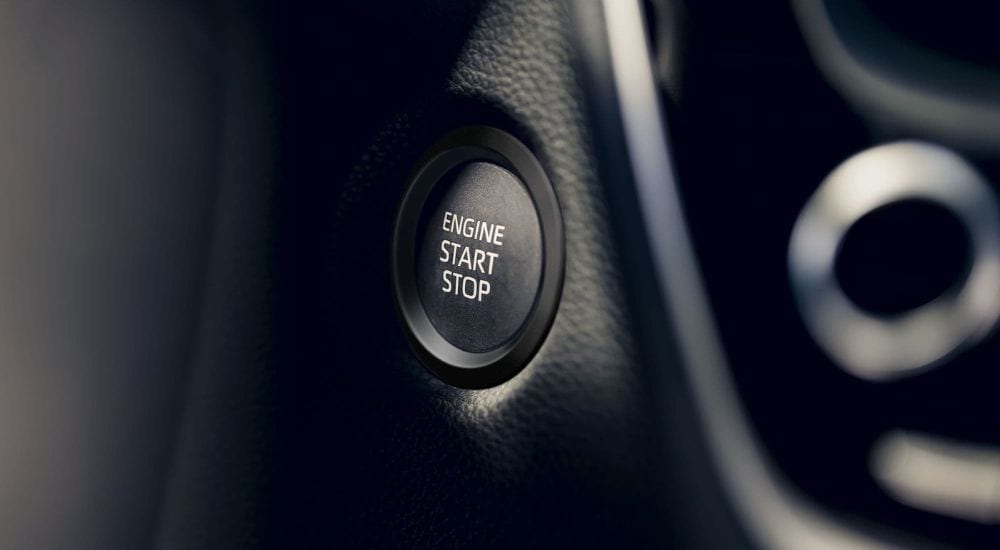 A close up shows the ignition button in a 2024 Toyota Corolla.