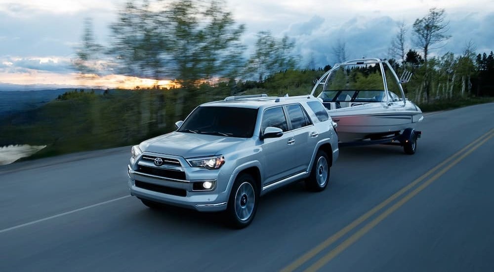A 2024 Toyota 4Runner Limited is shown towing a boat after visiting a Toyota dealer near Cadiz.