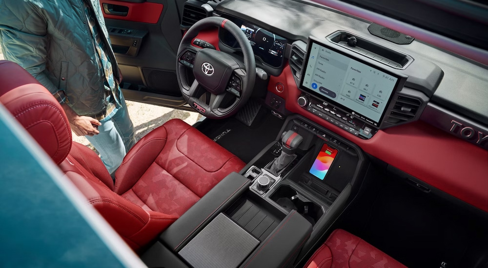 Overhead view of the red upholstery and accents in the cabin of a 2024 Toyota Tundra TRD Pro for sale.