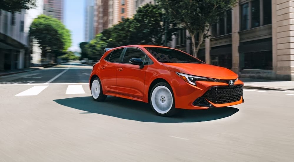 Toyota%20Corolla%20for%20sale%20-%202026%20Corolla%20hatchback%20-%20intersection.jpg An orange 2026 Toyota Corolla Hatchback driving in a city.