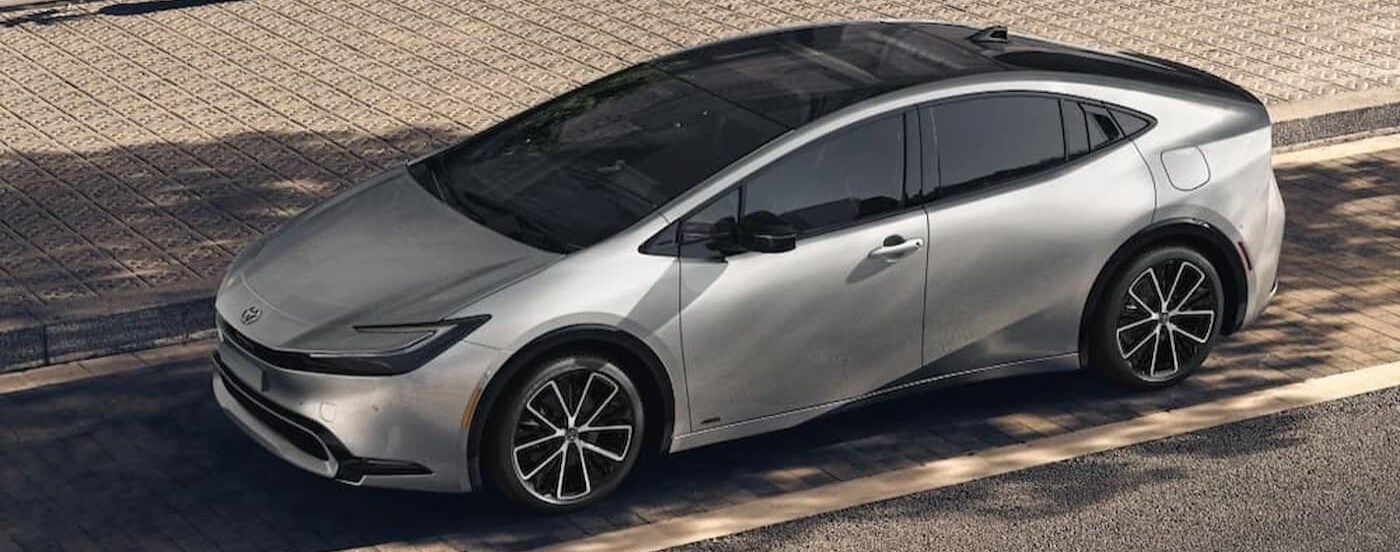 A silver 2024 Toyota Prius parked after viewing a used Toyota for sale near Madisonville.