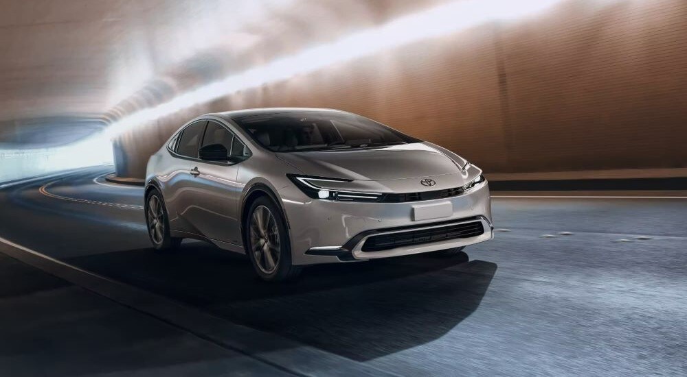 A silver 2023 Toyota Prius Limited driving through a tunnel.