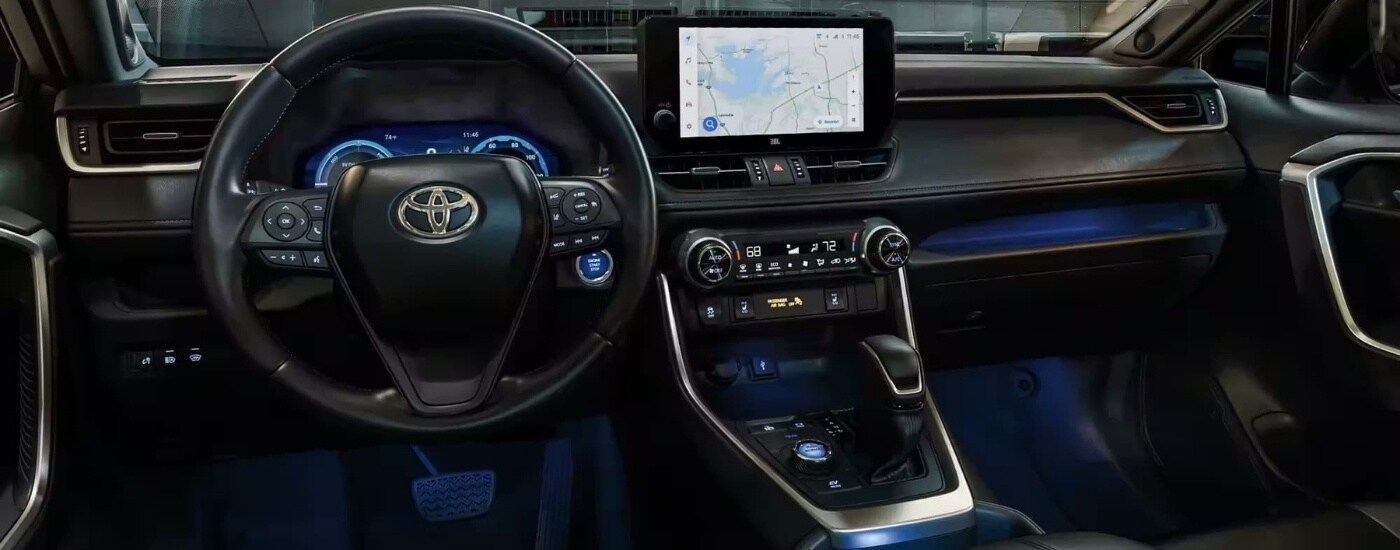 The black interior in a 2023 Toyota RAV4 for sale near Russellville.