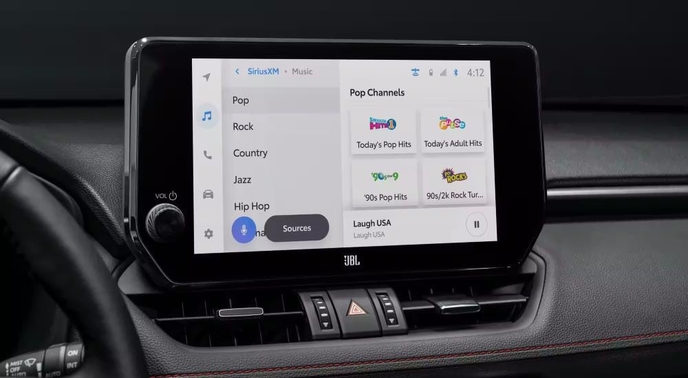 A close up shows the infotainment screen in a 2023 Toyota RAV4 Prime.
