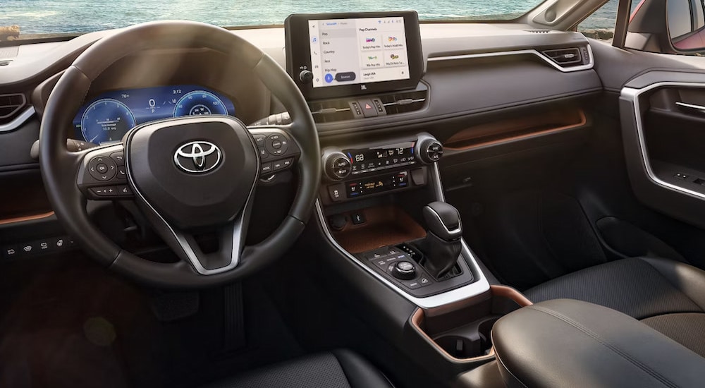 The cockpit in a 2024 Toyota RAV4 for sale.