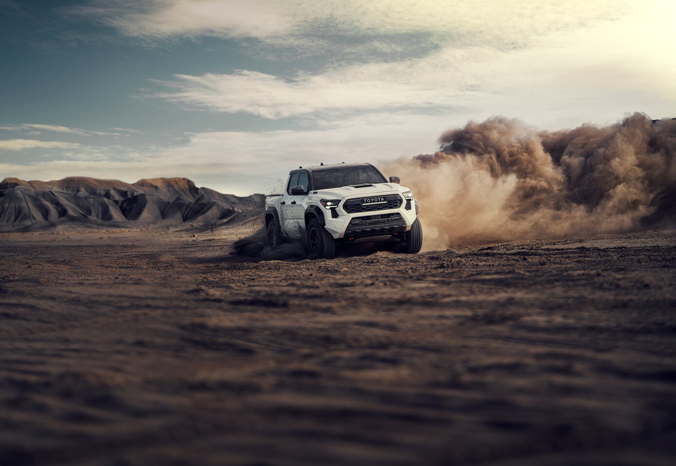 Toyota Tacoma Hybrid driving in the dirt