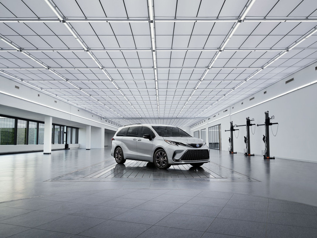 Silver Toyota Sienna in showroom