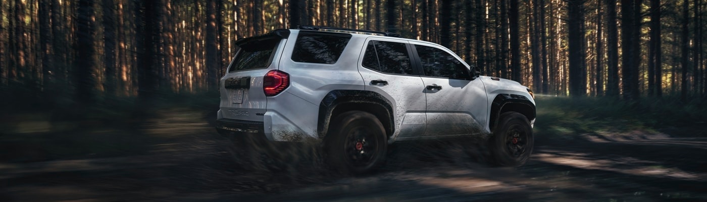 Toyota 4Runner White Toyota 4Runner TRD Off Road driving in the forest