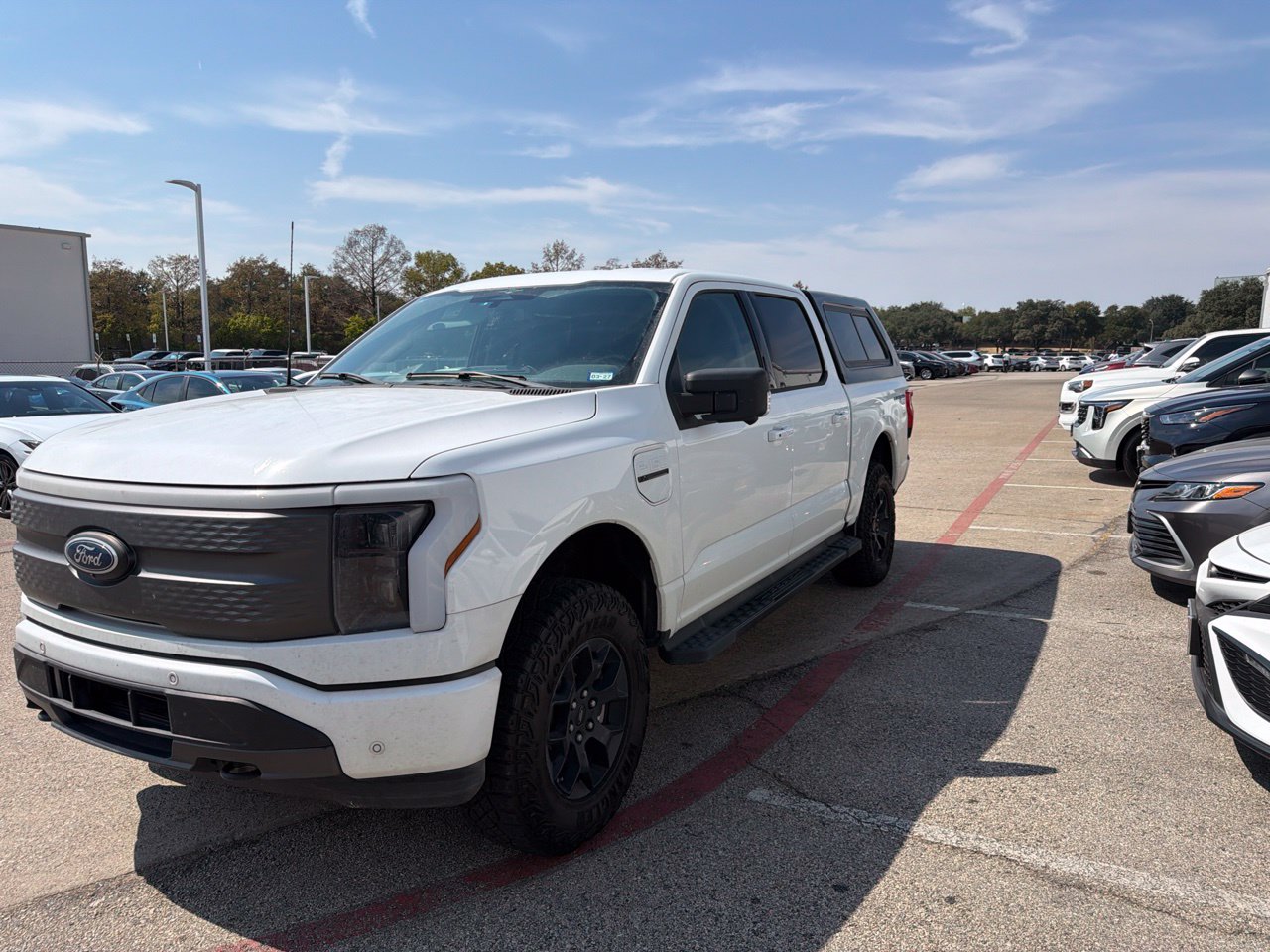 Used 2023 Ford F-150 Lightning XLT with VIN 1FT6W1EV5PWG39744 for sale in Richardson, TX
