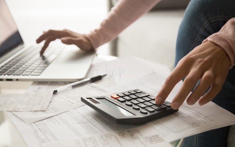 Lincoln Customer Calculating Payments at Home