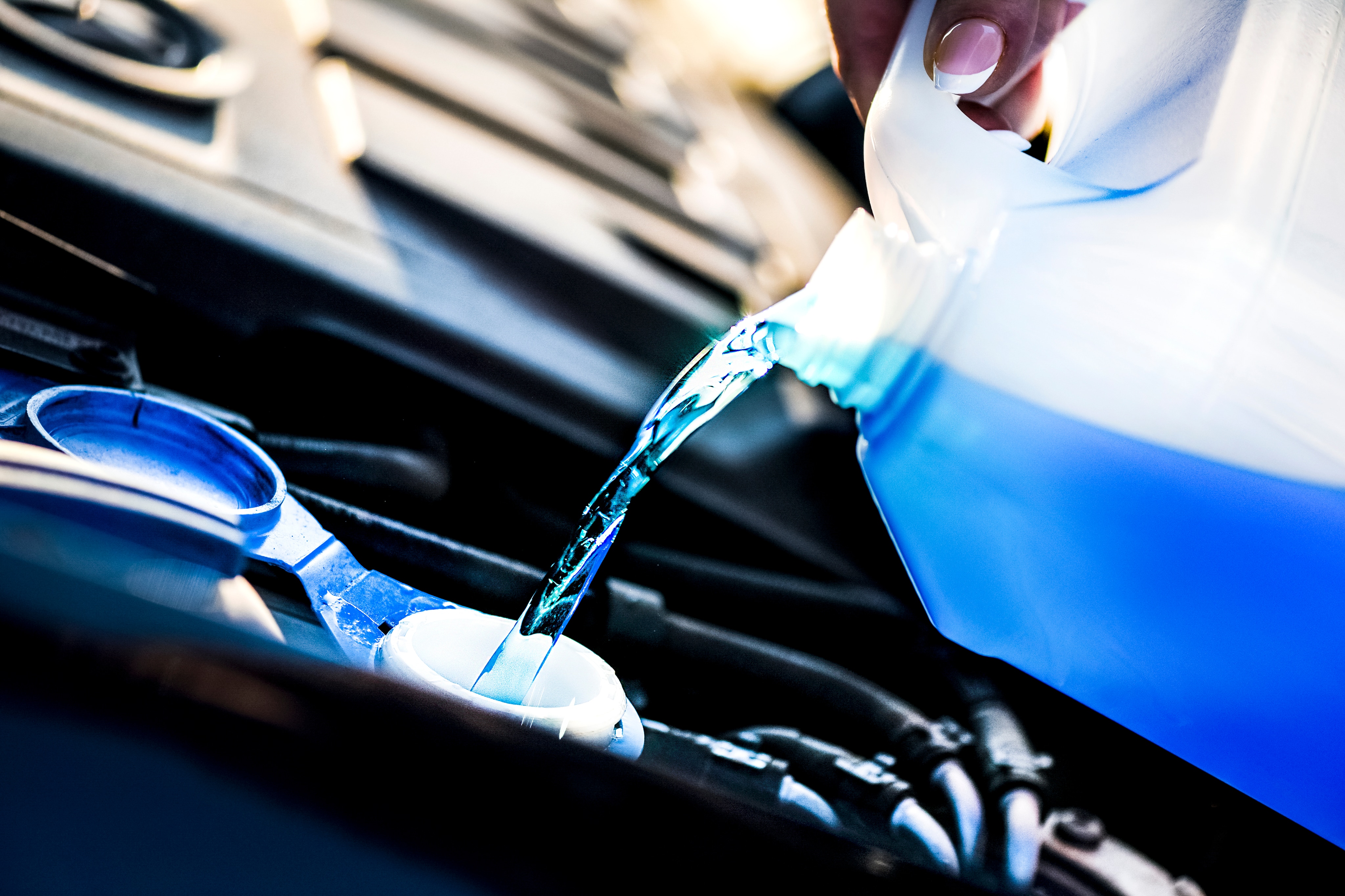 Car Fluid Being Topped Up