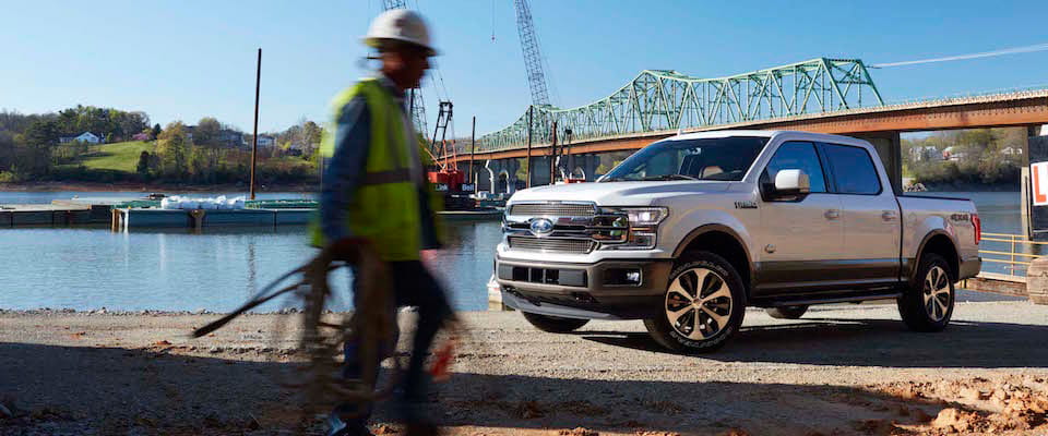 2019 Ford F-150 A white 2019 Ford F-150 parked by a construction site