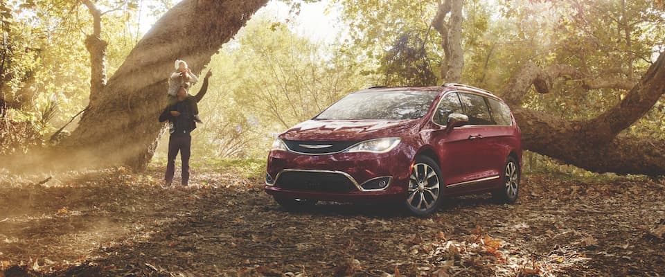2019 Chrysler Pacifica A father and daughter exploring in the woods with their Chrysler Pacifica