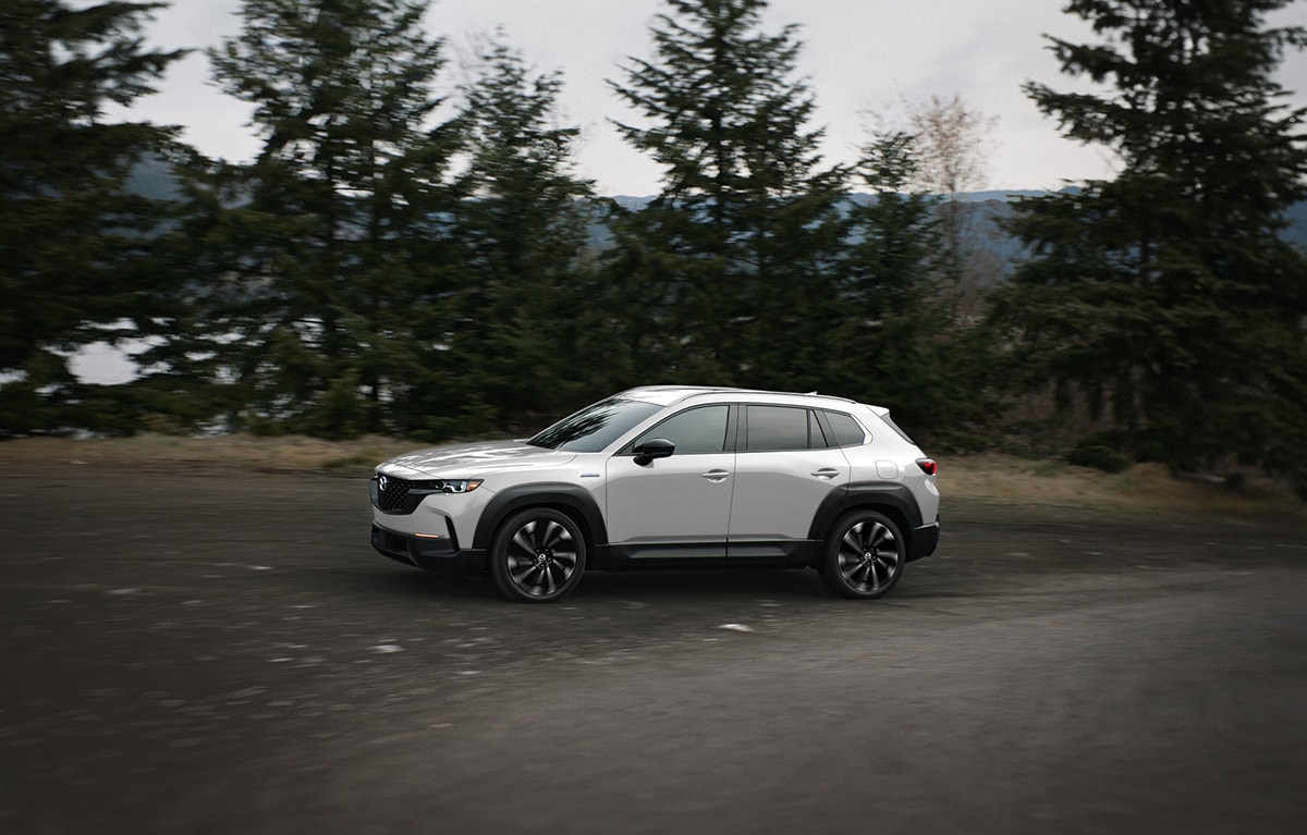 2026-mazda%3DCX-50-forest-cruising.png