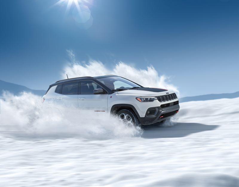Jeep Compass driving through deep snow