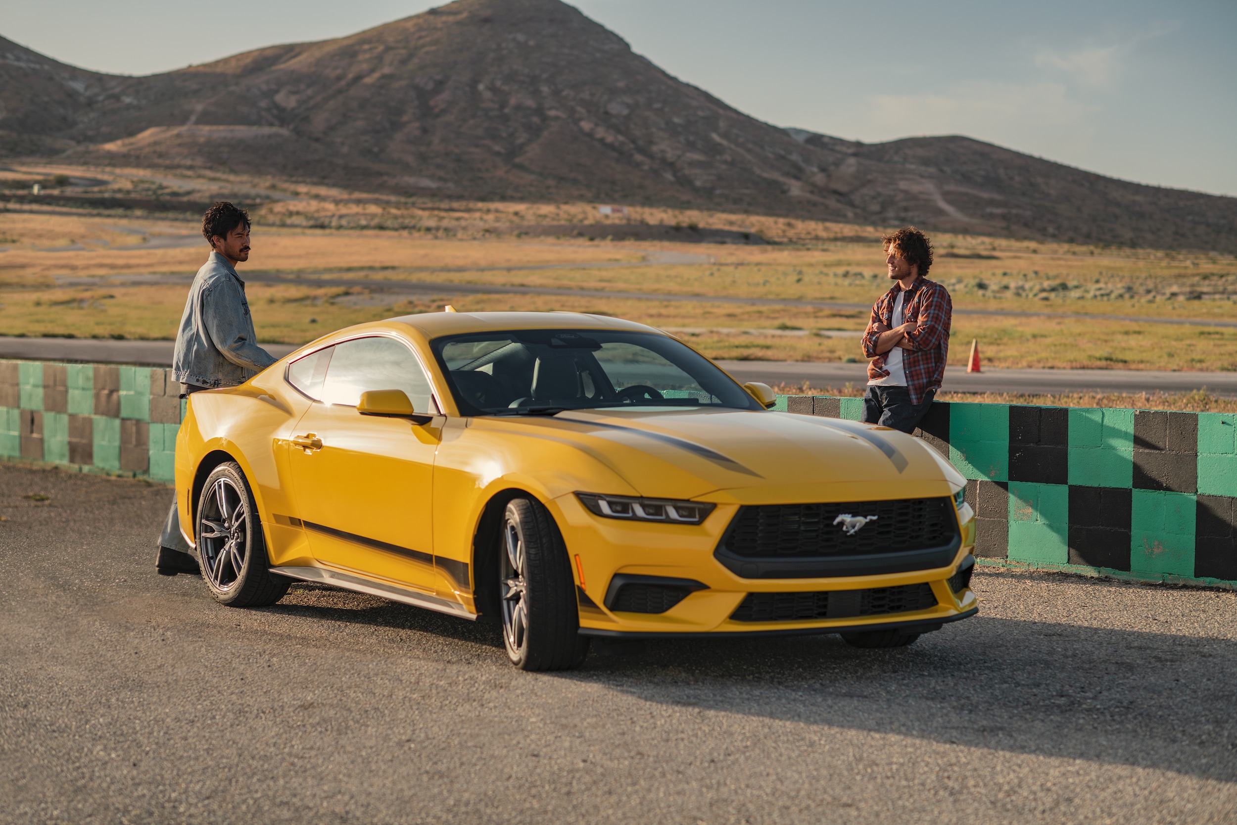 Yellow Ford Mustang on race track