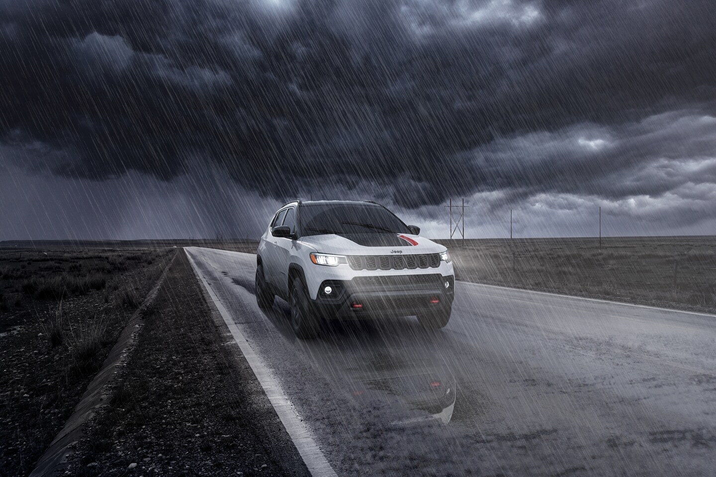 Grey Jeep Compass by the road