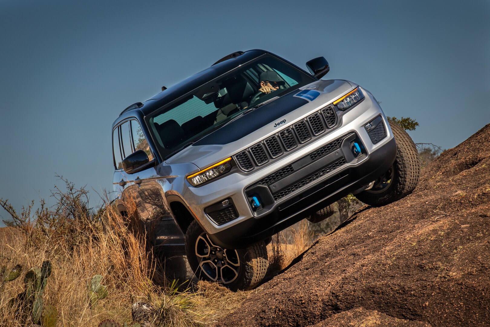  Jeep Grand Cherokee 4xe driving on dirt trail
