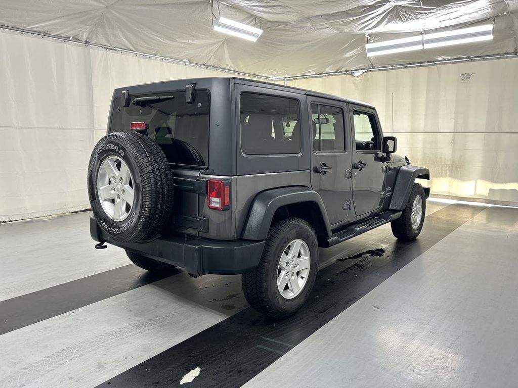Used 2014 Jeep Wrangler Unlimited Sport with VIN 1C4BJWDG2EL299271 for sale in Cicero, NY