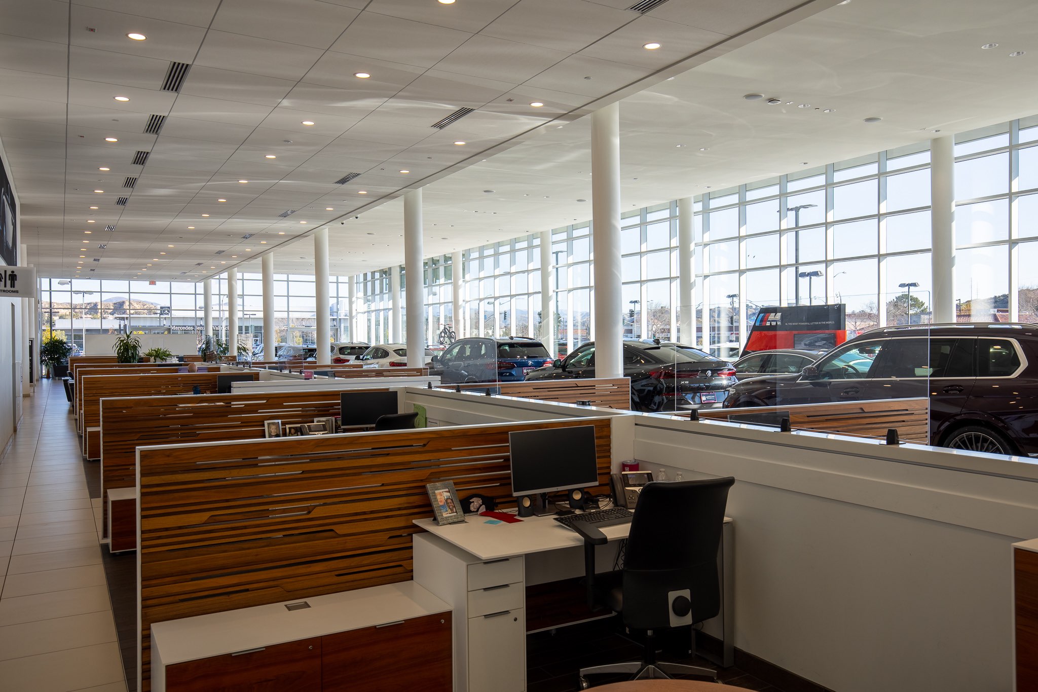 Interior view of Valencia BMW, focused on bays of desks with chairs.