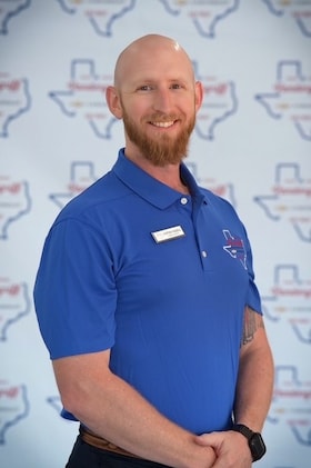 Staff member Cotton Feazell from ID_a0a29a25b27c