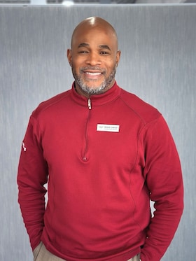 Staff member Reggie Carter from ID_a2834cc4964e