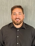 Staff member Carlos Lewis from ID_a0a29a25b27c