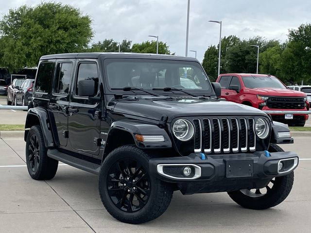 Used 2022 Jeep Wrangler Unlimited Sahara 4XE with VIN 1C4JJXP69NW197999 for sale in Arlington, TX