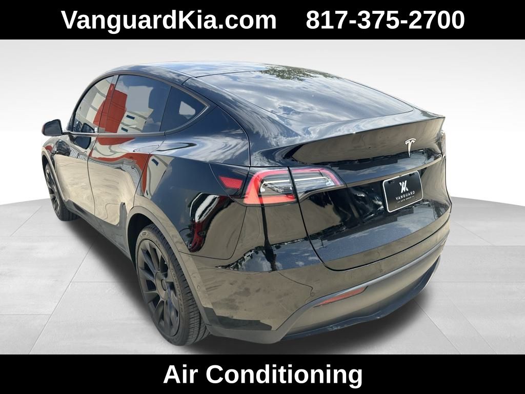 Used 2021 Tesla Model Y Standard Range with VIN 5YJYGDED8MF115082 for sale in Arlington, TX