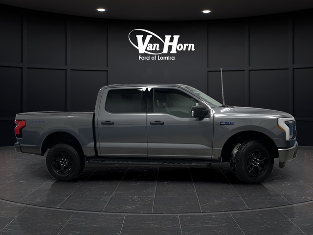 Used 2025 Ford F-150 Lightning XLT with VIN 1FTVW3LK9SWG13771 for sale in Lomira, WI