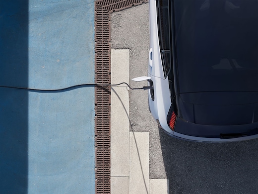 Volvo electric vehicle plugged into a charging station