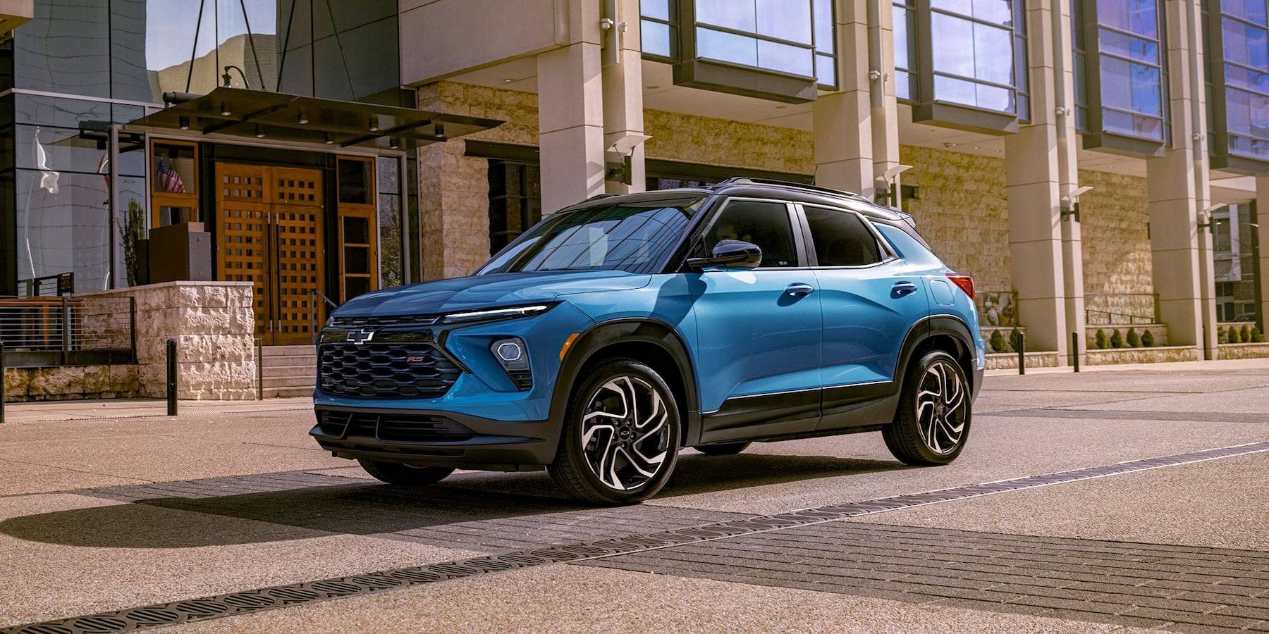 Side exterior view of a blue 2025 Chevy Trailblazer