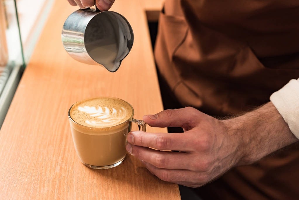 Man pouring a cup of coffee