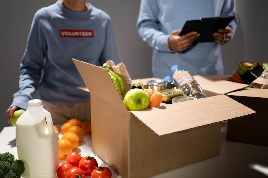 Man and woman volunteers at a food bank