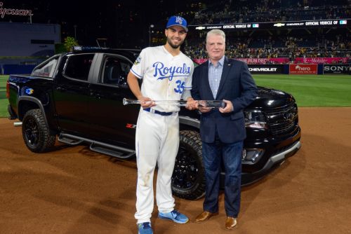 2016 MLB All-Star Game Most Valuable Player Eric Hosmer (left) of the Kansas City Royals celebrates with Chevrolet U.S. Vice President Brian Sweeney, his MVP trophy and a Chevrolet Colorado Diesel Midnight Edition pickup - the vehicle he chose as an award for his MVP performance Tuesday, July 12, 2016 at Petco Park in San Diego, California. New Chevy Colorado dealer near Ann Arbor MI