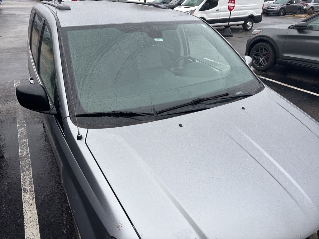 Used 2019 Dodge Grand Caravan SXT with VIN 2C4RDGCG3KR734976 for sale in Kansas City