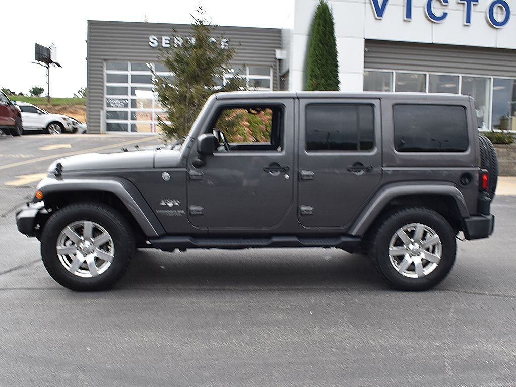 Used 2016 Jeep Wrangler Unlimited Sahara with VIN 1C4BJWEG4GL256472 for sale in Dyersville, IA