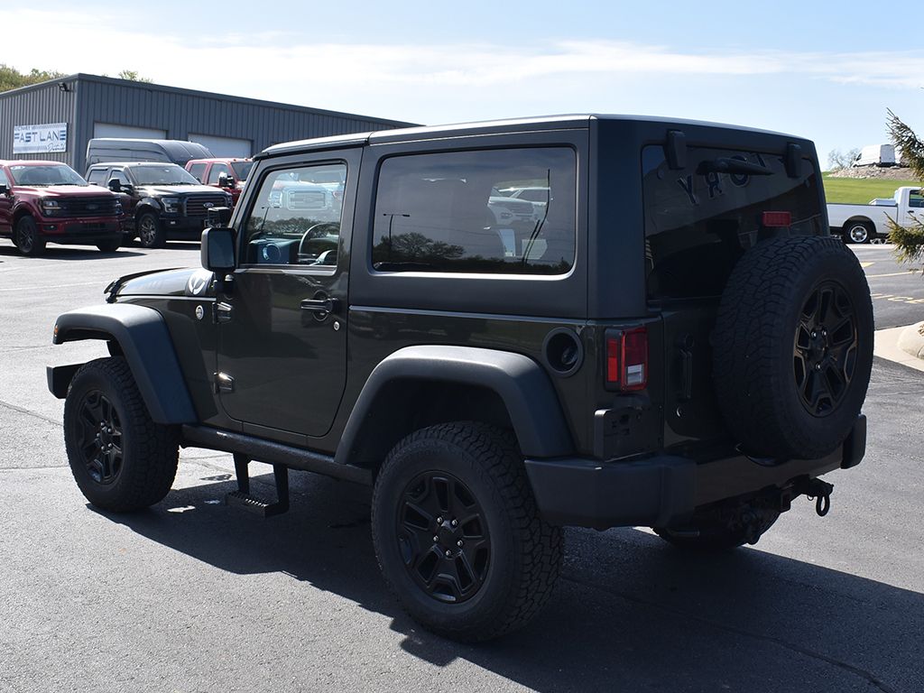 Used 2015 Jeep Wrangler Sport with VIN 1C4AJWAG0FL716971 for sale in Dyersville, IA