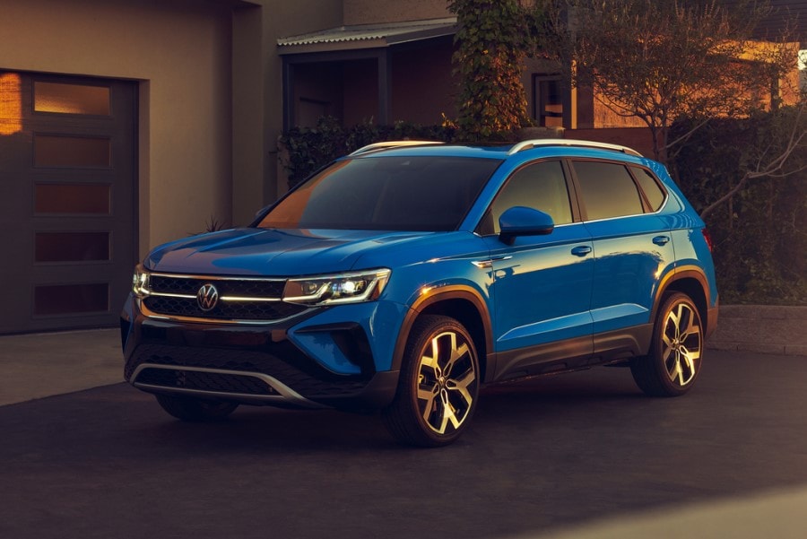 blue Volkswagen Taos parked in a driveway