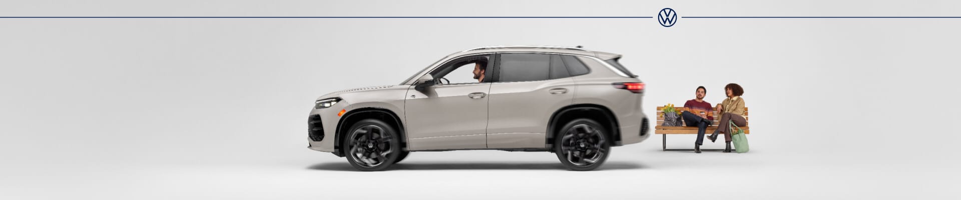 2026 Volkswagen Tiguan SEL R-Line Turbo in Sandstone with a white backdrop