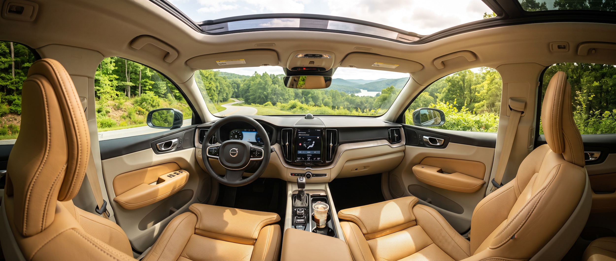 2026 Volvo XC60 interior with blond ventilated Nappa leather seats and dual-zone climate controls on a hot Greenville SC summer day
