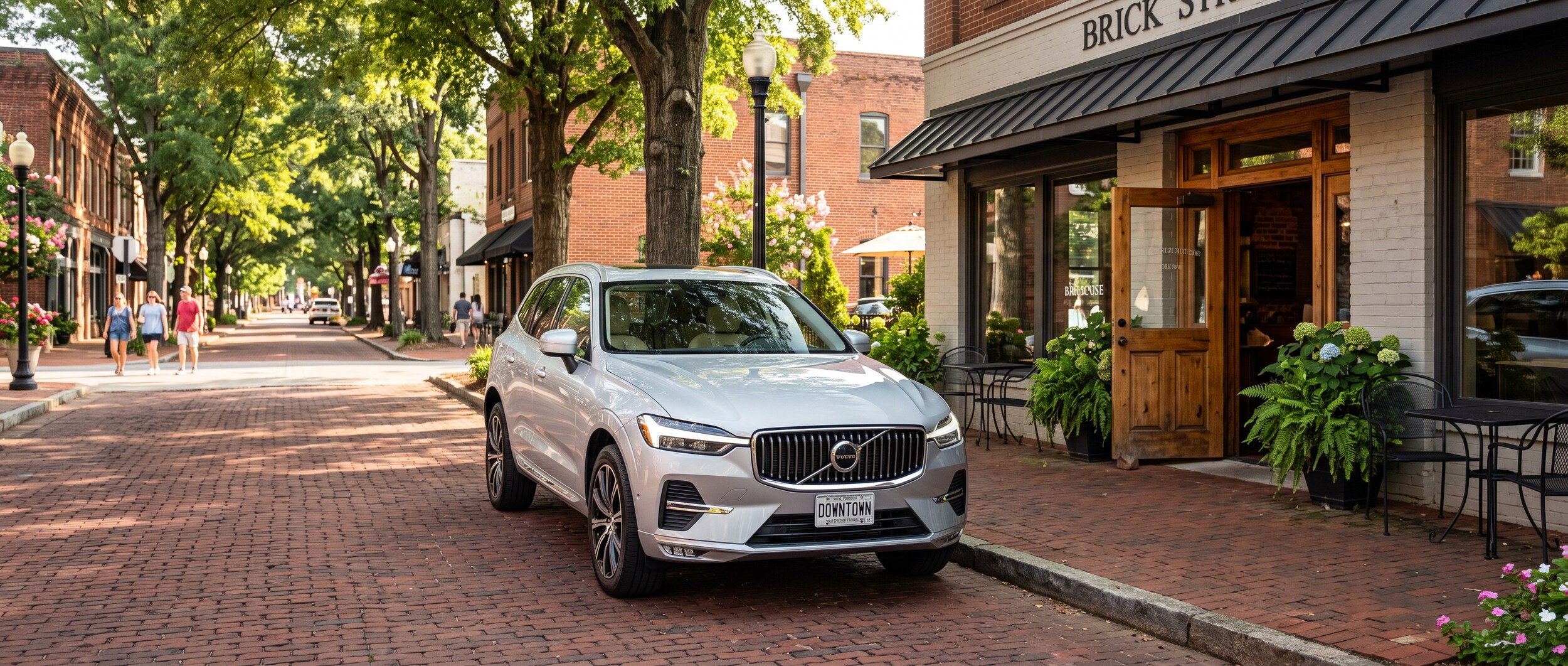 2026 Volvo XC60 parked near a downtown Greenville SC coffee shop on a sunny August study day