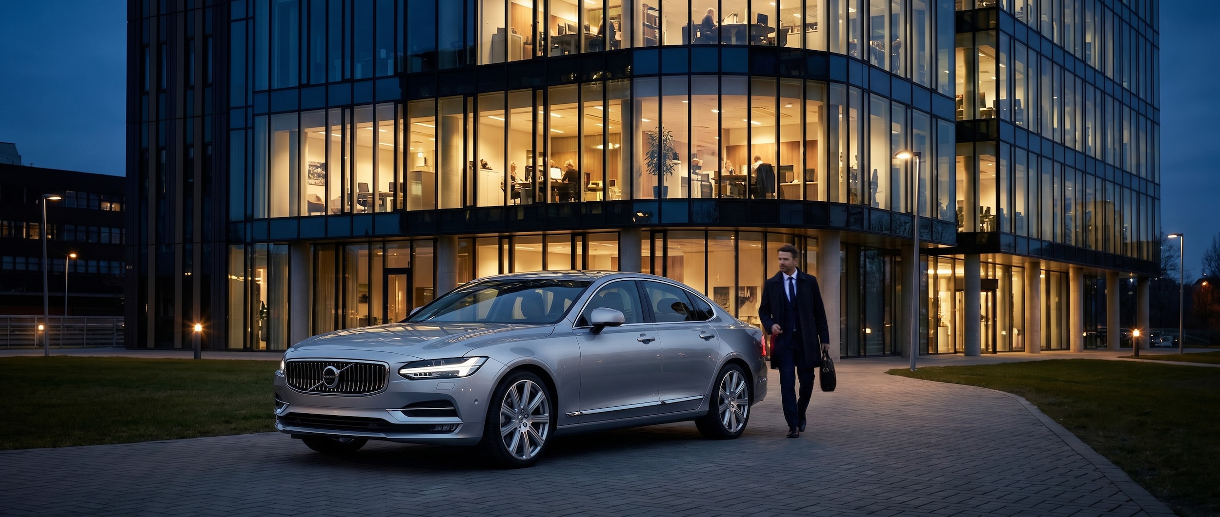 Volvo S90 executive luxury sedan parked outside office building in Greenville SC