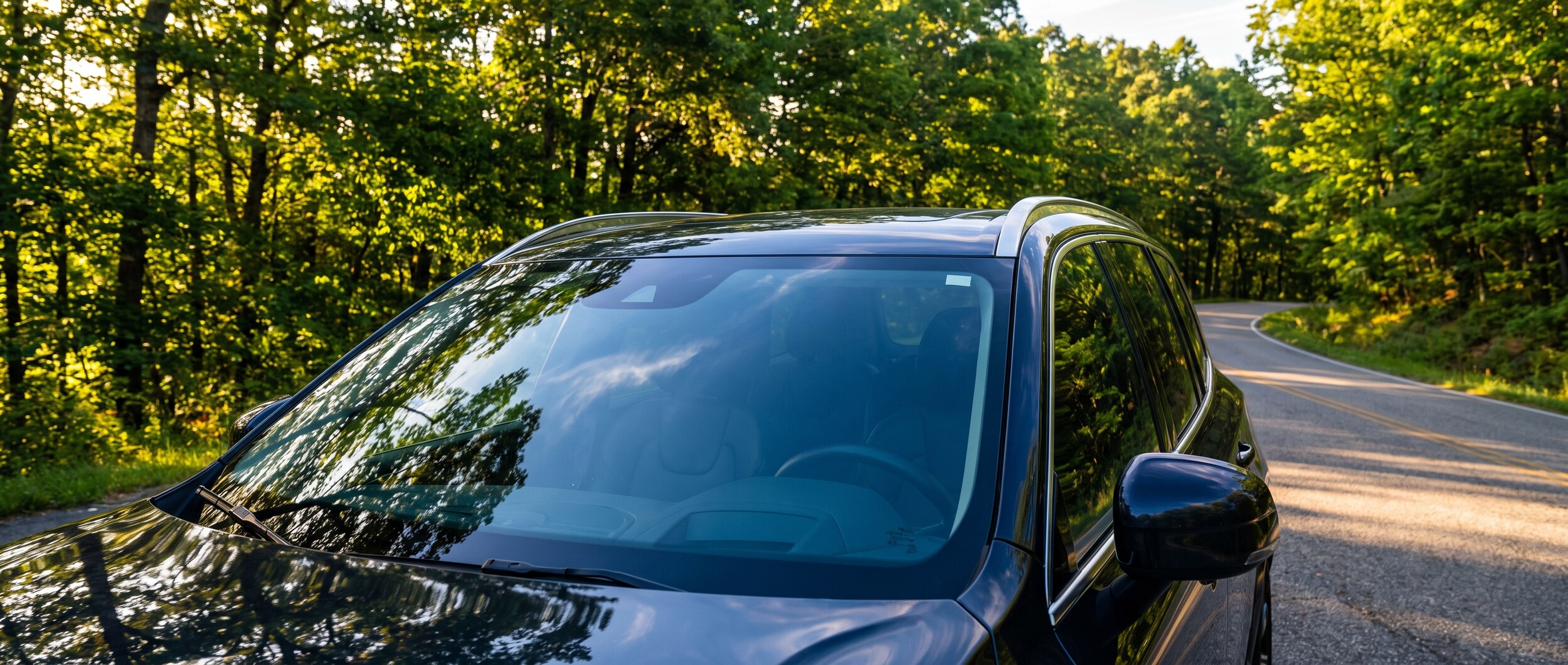 Volvo XC60 parked in summer heat outside a Greenville SC service center