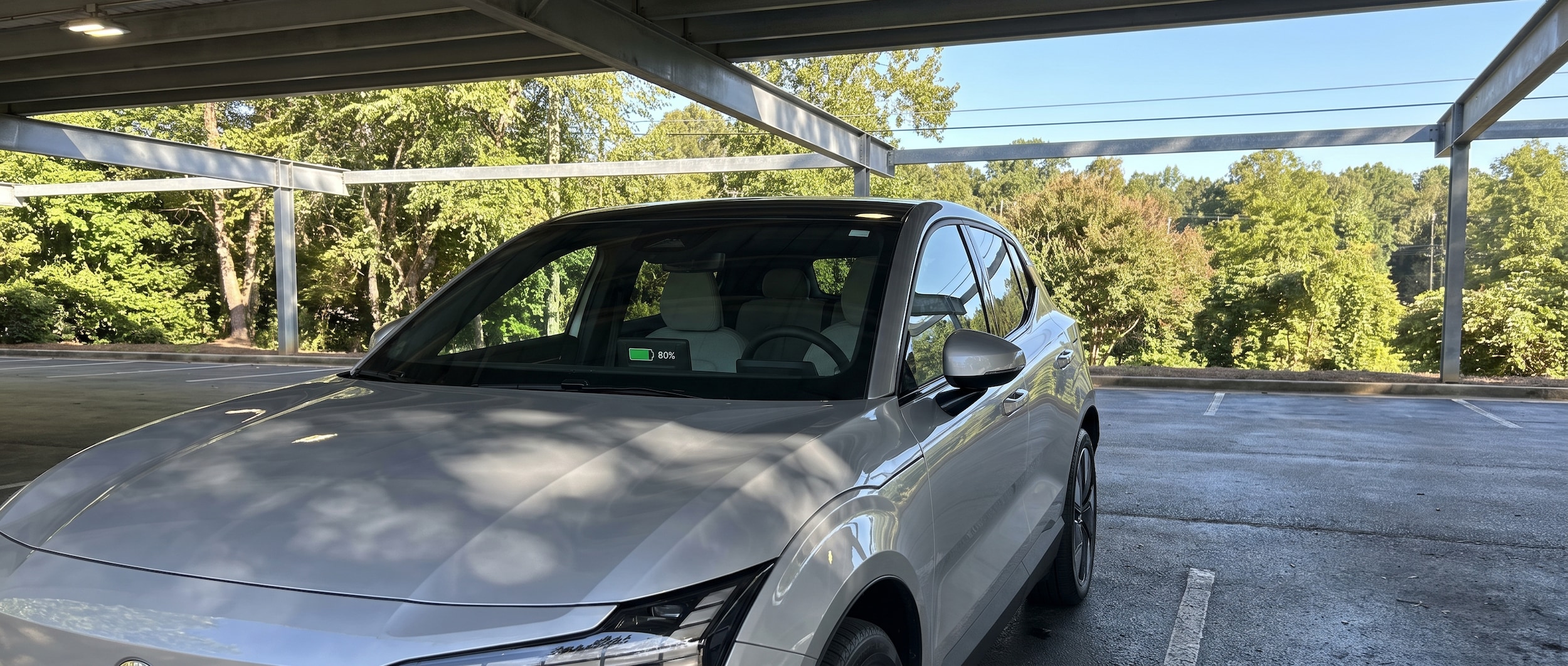 2026 Volvo EX40 parked in shade in Greenville SC summer heat with battery charge indicator visible