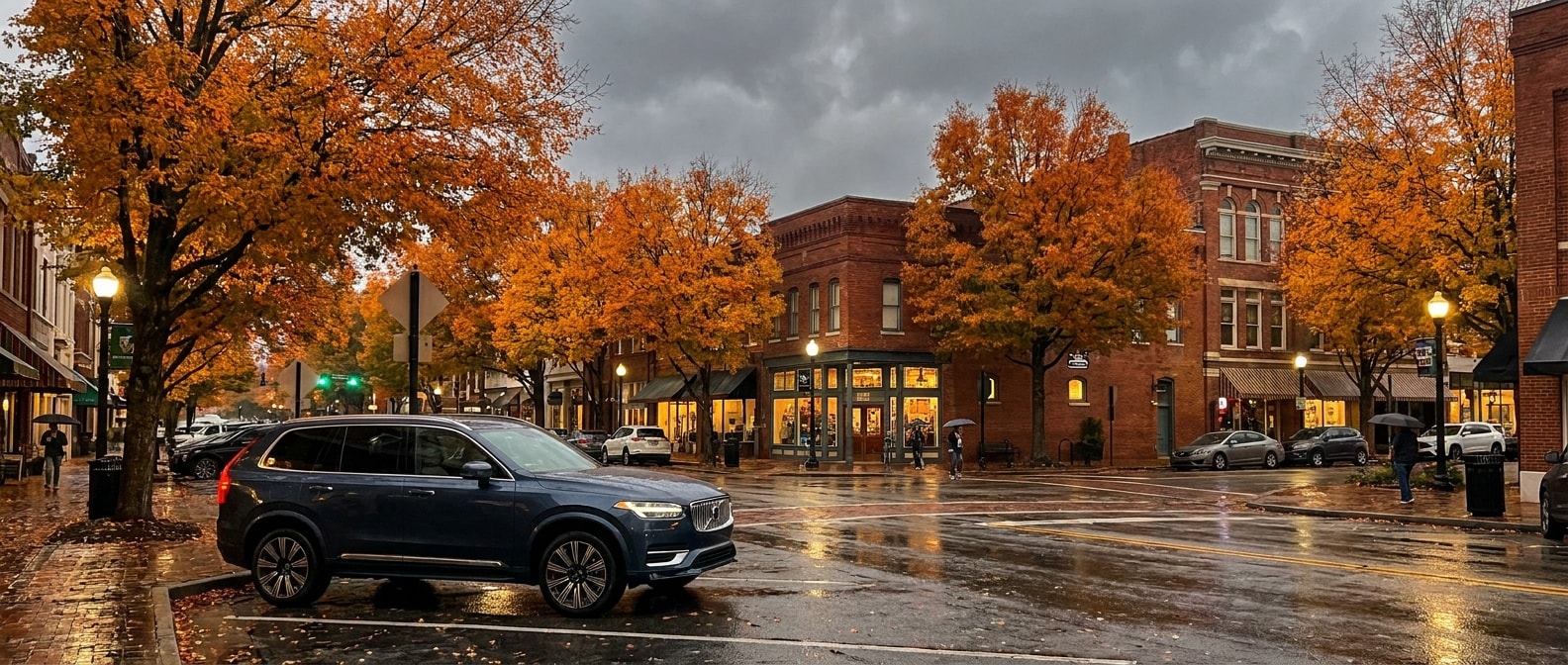 2026 Volvo XC90 parked in downtown Greenville SC on a foggy October evening among autumn foliage