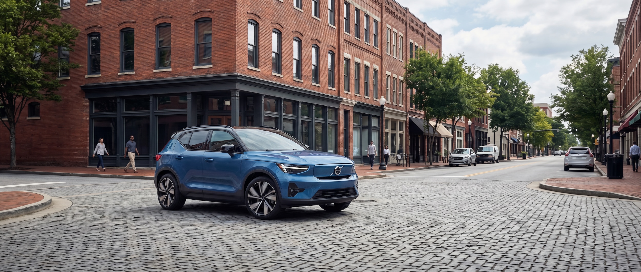 Volvo XC40 compact SUV driving through downtown Greenville SC