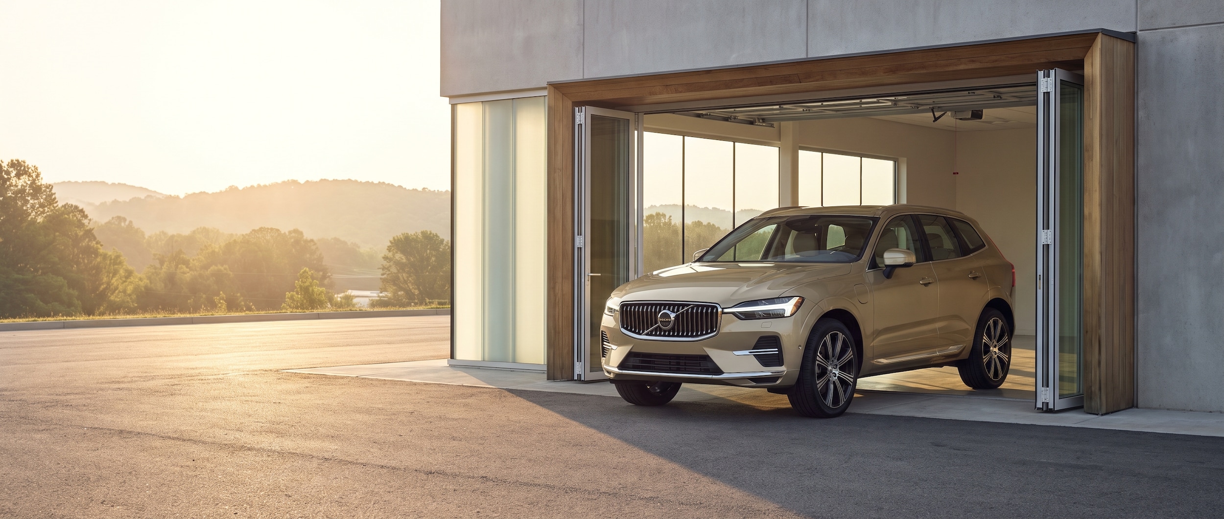 2026 Volvo XC60 at a Greenville SC dealership service bay entrance on a hot summer day